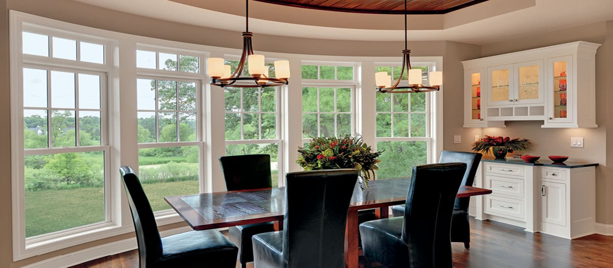 wraparound double hung windows in a dining room