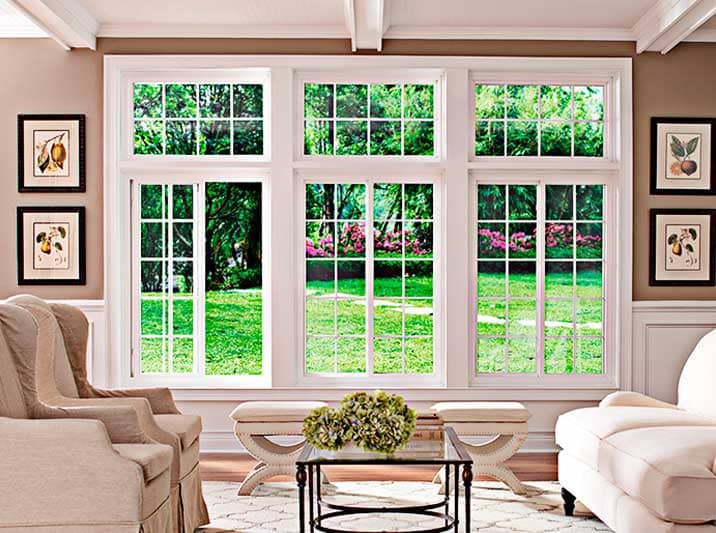 Triple Sliding Windows with muntins in a living room