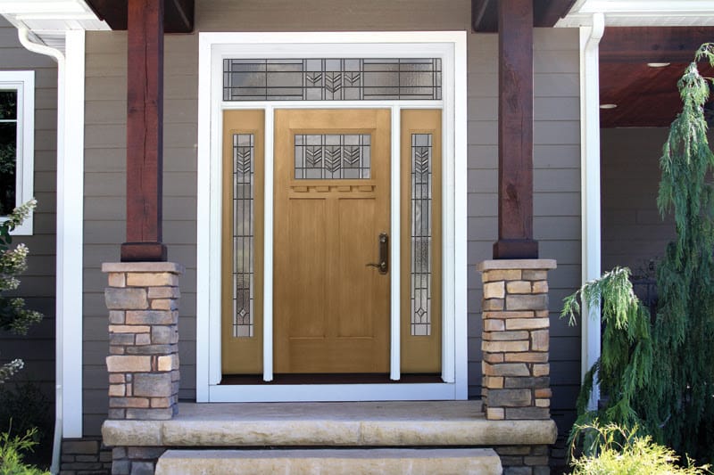 solid wood front door with decorative window at the top